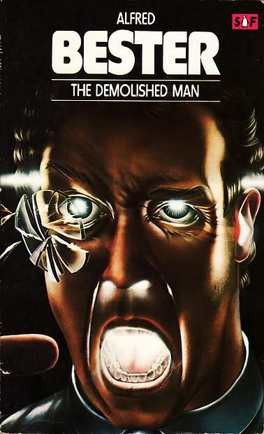 The book cover of "The Demolished Man". The man's eye, ears and mouth look as thoiigh white fire is coming out fo them, a fragmented glass lens in front of one eye.