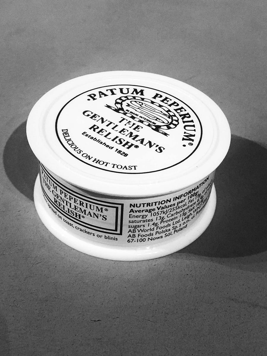The classic patum peperium "Gentleman's Relish" jar. This is in B&W. It's no longer a ceramic jar, just some dumb piece of plastic shit. Such is life.