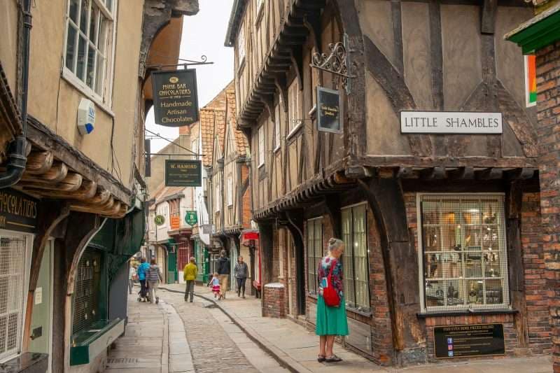The Shambles street in York, overhanging medieval buildings and cobbled streets.