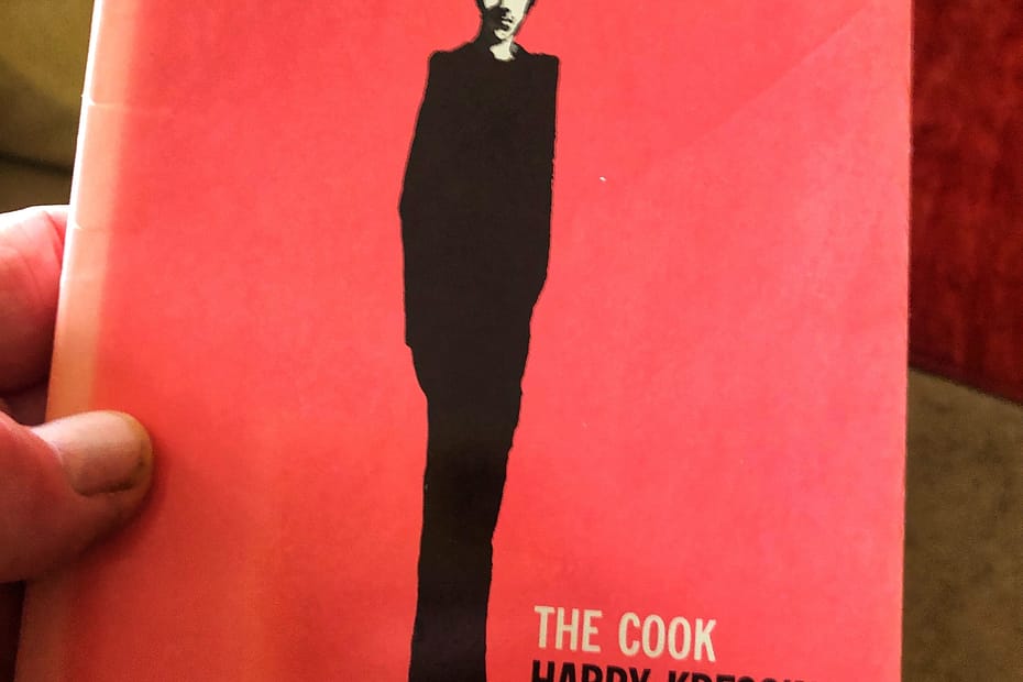 This book cover is by the wonderful Milton Glser. It shows an incredibly thin, tall man, dressed all in black apart from the white of his chefs' hat. He's casting a drk shadow across the pink background.
